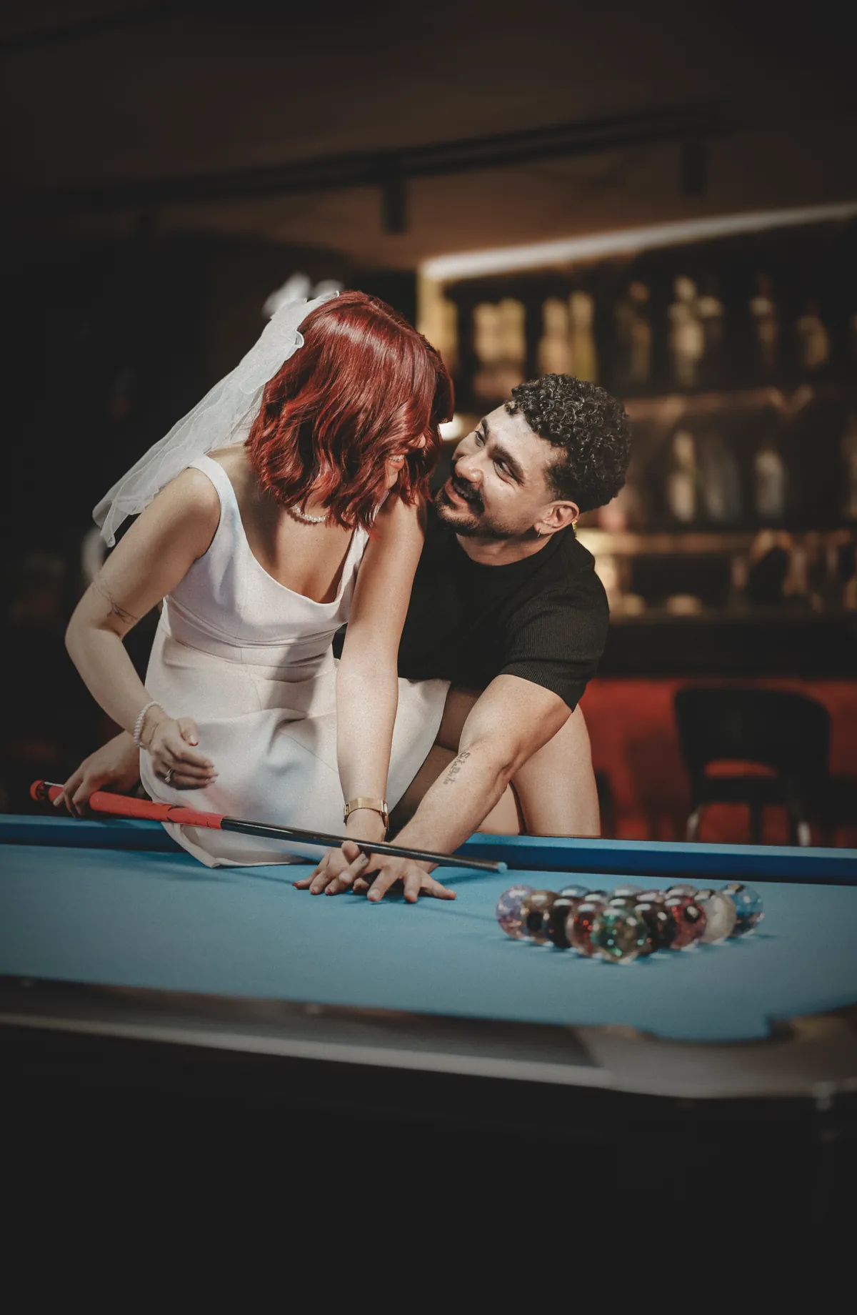 Jose & Sophie sharing a laugh over the pool table — behind the scenes
